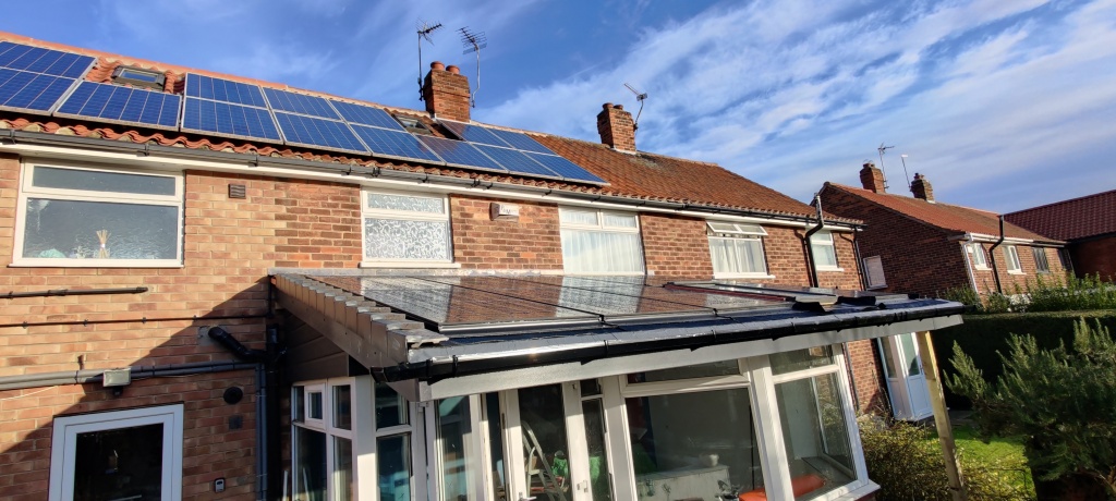 Rebuilt conservatory roof with in-roof PV panels, zoomed out.